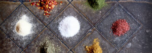 Colorful Spices On Tile Floor