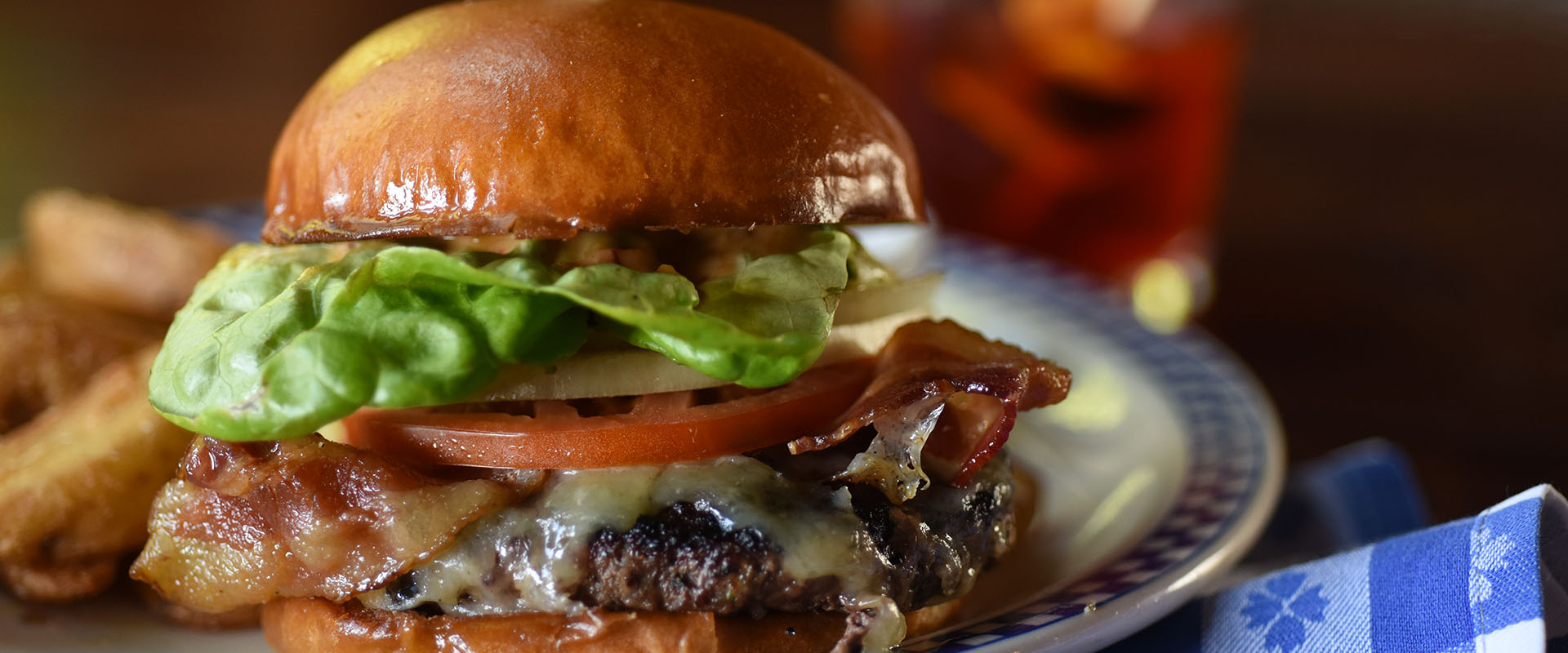 Dukes Seafood Cheeseburger with bacon, lettuce, tomato, and onion