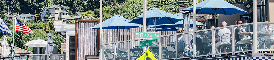 Duke's Seafood Alki Beach restaurant outside dining under blue umbrellas