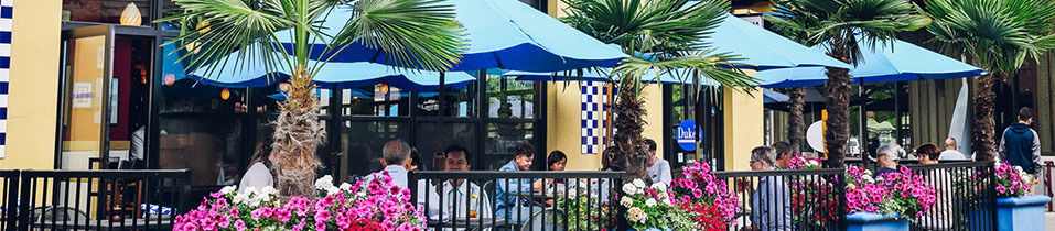 Dukes Seafood Kent Station restaurant outside dining under blue umbrellas