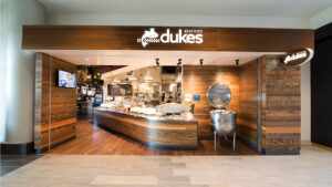 Front entrance of Duke's Seafood Bellevue restaurant with oyster bar display